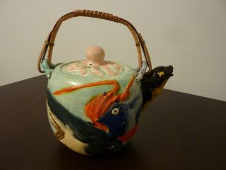 Antique bisque Japanese teapot with embossed fish lobster crab & octopus cover 2