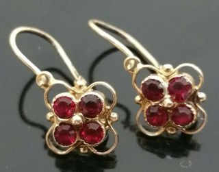 Victorian Era 14 Karat Yellow Gold.  50 Ct Rose Cut Ruby Hinged Dangle Earrings