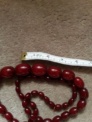 Antique Cherry Amber Bakelite Beads.  Marbled.  Oval.  Graduated - Weigh 92.  2 Gms