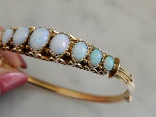 A Victorian Antique 9 Ct Gold 12.  00 Carat Oval Opal Bangle