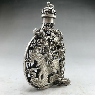 A phoenix image of a silver snuff bottle carved by hand in ancient Tibet 3