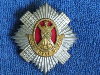 Wwi British Royal Scots 2 Color Stamped Brass Cap Badge With Red Felt Backing
