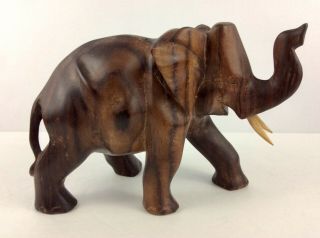 Elephant Hand Carved From Iron Wood With Details.  6 1/2”t By 8 1/2” W