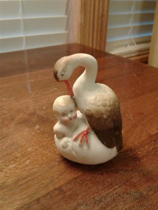 Vintage Art Nouveau Bisque Figurine Stork Watching A Baby Coming Out Its Egg