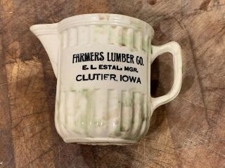 Spongeware Jug E.  L.  Estal Lumber Clutier,  Iowa