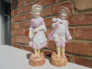 Pair Antique Victorian Era Bisque Porcelain Boy Girl Tennis Players 9 3/8 "