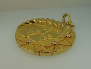 Tiffany & Co.  18k Gold Diamond Gemini Pendant - 42 Grams, .  30ctw