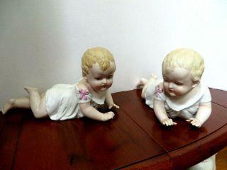German Bisque Porcelain Piano Girl Babies,  Stamped 23/109,  10 " Long