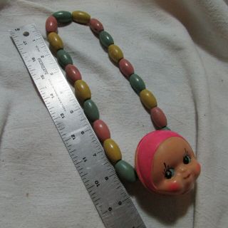 Unusual Cool Vintage Thin Celluloid Baby Doll Head Rattle Toy,  Wood Bead Strand 8