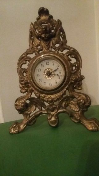 Antique Iron Ornate Figural Rococo Style Clock Cherub Face Lion Feet