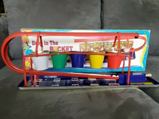 Vintage Drop In The Bucket Classic Tin Marble Game Spring Load Launcher