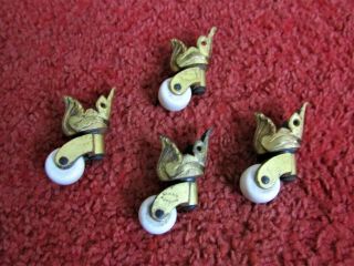 Salvaged Set Of 4 Brass Castors White China Clay Wheels - Furniture Table Shell