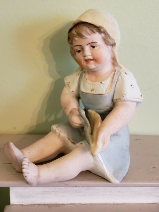Antique German All Bisque Porcelain Piano Baby Figurine Girl Husking Corn