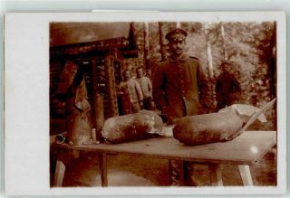 53051525 - German Wwi Artillery Shells On A Table Rppc Wk I