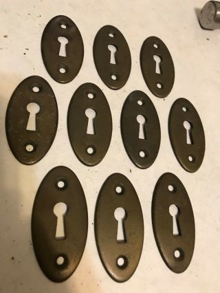 10 Old Oval Brass Plate Stamped Steel Keyhole Door Knob Covers Escutcheon Plates