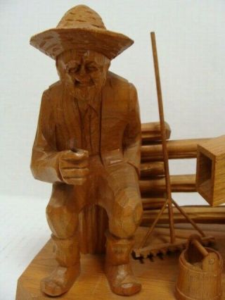 Caron Wooden Figurine Country Man Farmer with Pipe Fence Hand Pump Signed 8x7x5 3