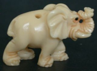 Vintage Japanese ivory colored bone netsuke - Baby Elephant Walks with Trunk up 2