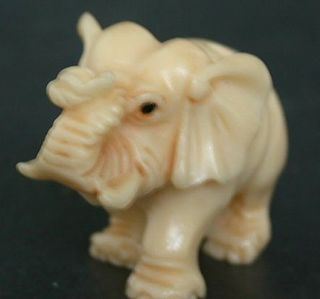 Vintage Japanese ivory colored bone netsuke - Baby Elephant Walks with Trunk up 4