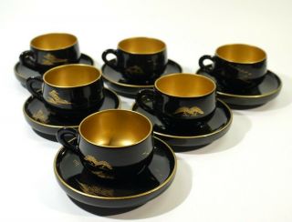 Set Of 6 Signed Japanese Painted Black & Gilt Laquered Cups & Saucers