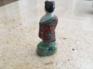 Antique chinese porcelain figure of a chinese man,  20th century 4.  75”stamped 2