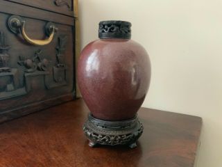 18thc Chinese flambé jar with hardwood stand and carved cover. 12