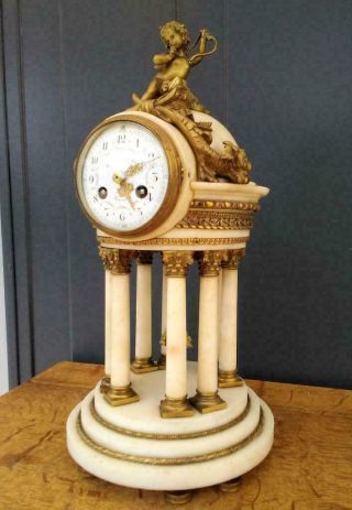 Antique French Bronze And White Marble 8 Column Clock With Cupid