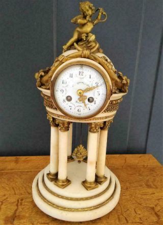 Antique French bronze and white marble 8 column clock with cupid 2