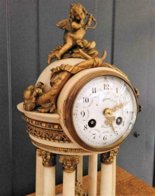 Antique French bronze and white marble 8 column clock with cupid 3