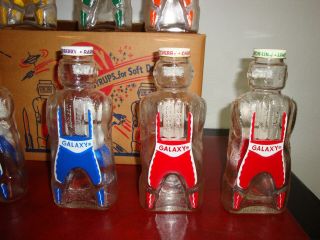 12 Vintage Galaxy Syrup Space Man Bottle Banks Full Case W/Original Box NOS 8