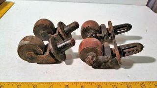 Set Of 4 Vintage Castors - Cast Steel With Wooden Wheels