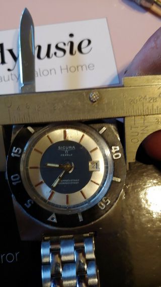 SICURA SAFARI HIDDEN KNIFE VICTORINOX AUTOMATIC DON ' T SNOOZE YOU CAN ' T FIND TRY 3