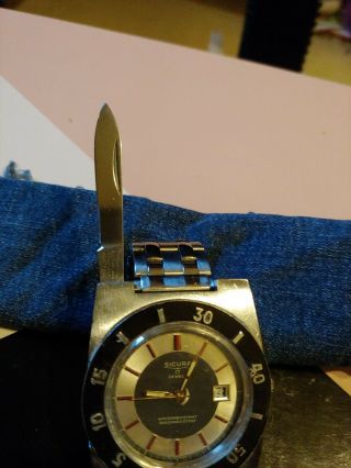 SICURA SAFARI HIDDEN KNIFE VICTORINOX AUTOMATIC DON ' T SNOOZE YOU CAN ' T FIND TRY 7