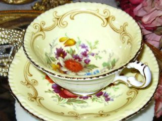 PARAGON YELLOW TEACUP & SAUCER FLORAL CENTER FANCY FOOTED DOUBLE WARRANT 3