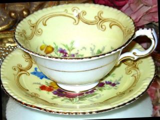 PARAGON YELLOW TEACUP & SAUCER FLORAL CENTER FANCY FOOTED DOUBLE WARRANT 5