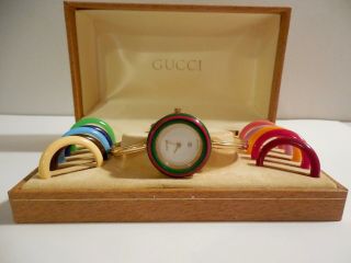 Vintage Ladies Gucci Interchangeable Bangle Watch With 12 Color Bezels.