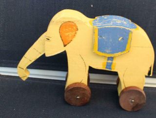 Vintage Wooden Elephant Pull Toy Yellow With Blue Trunk Down
