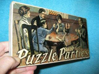 Boxed Set Of Antique " Metal Puzzles  Puzzle Parties " In Litho Box