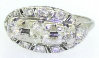 Vintage 14K WG.  74CTW VS diamond wedding/engagement ring w/.  28CT ctr.  size 5. 2