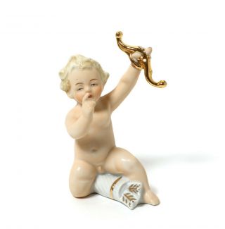 Porcelain Figurine Nude Boy With Bow (putti).  Europe.