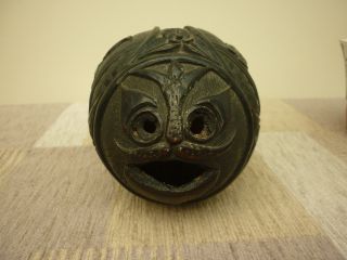 Antique Carved Coconut Money Box with Dutch Figures a Fish Head and Floral Ends 8