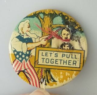 WWII UNCLE SAM ADOLF HITLER – LET’S PULL TOGETHER BUTTON PIN – EVANS NOVELTY 2