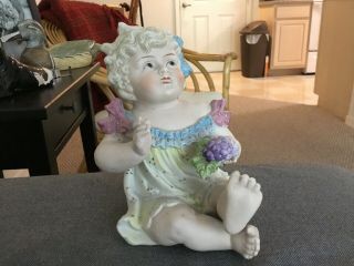 Lovely Vintage German Bisque Porcelain Piano Baby Girl Holding Grapes,  6” Tall