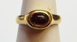 Antique 18 Karat Gold With Cabochon Ruby Stirrup Ring