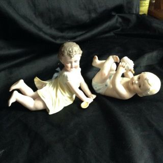 Set Of 2 Of Bisque Porcelain Piano Baby Doll Figures Germany ?