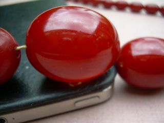 Antique Art Deco Cherry Amber Bakelite Bead Necklace 90.  72 grams. 4