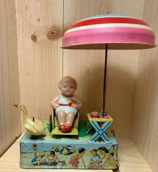 Vintage Tin Litho Wind Up Tin Toy Happy Life Celluloid Girl On The Beach 1950s