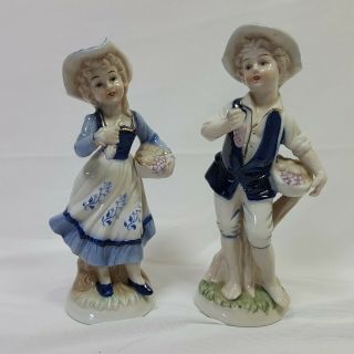 Two Vintage Porcelain Man And Woman Figurines In Delft Blue 7 Inches Tall Hats