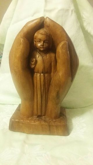 Hand Carved Wood Figure With Two Hands Holding The Christ Child
