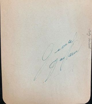 Judy Garland Vintage Autograph On A Tan 4x5 Sheet.