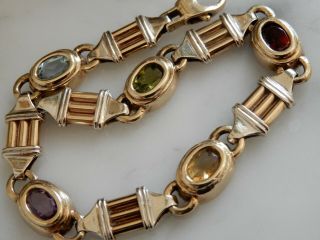 A Solid 9 Ct Gold Multi Gemstone Set Bracelet